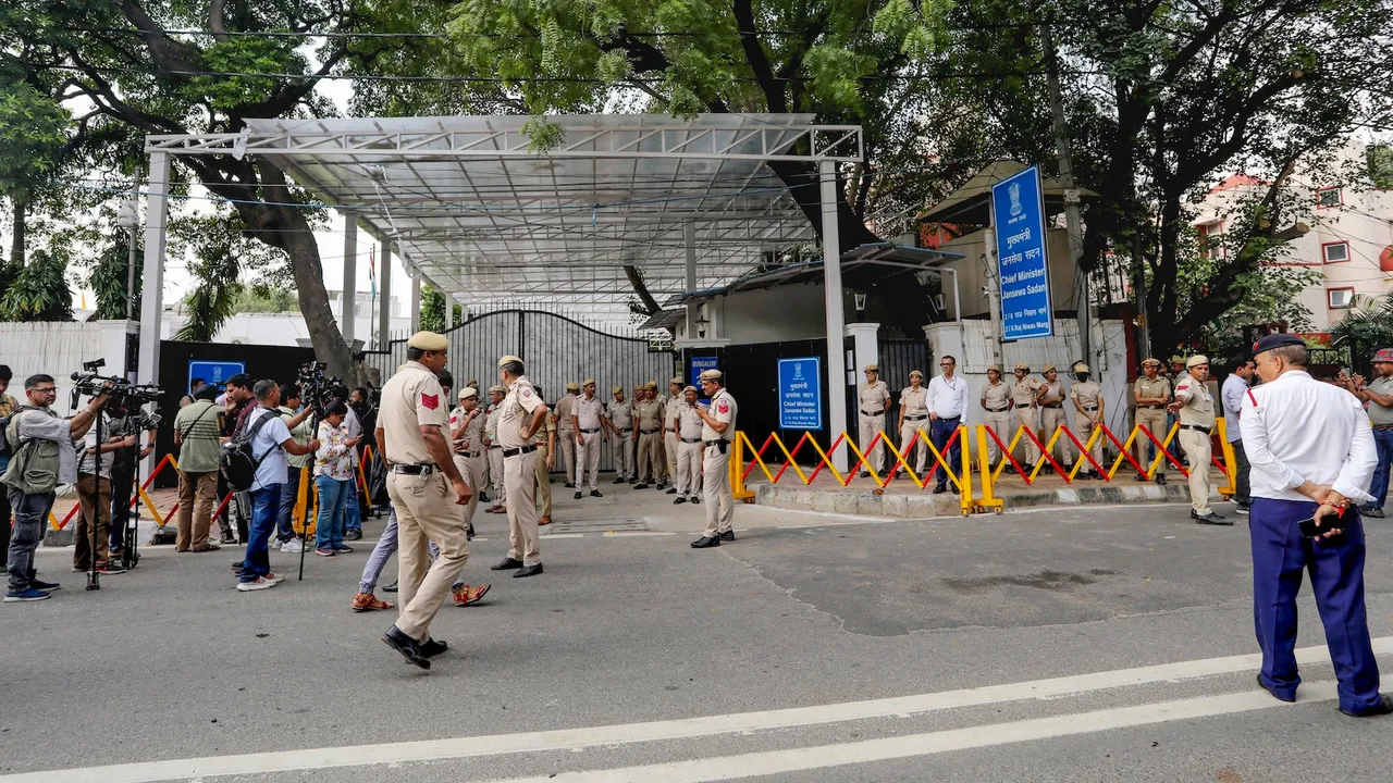 Police personnel outside Delhi CM Rekha Gupta's residence after an attack on her during a 'Jan Sunwai' programme, in New Delhi, Wednesday, Aug. 20, 2025.