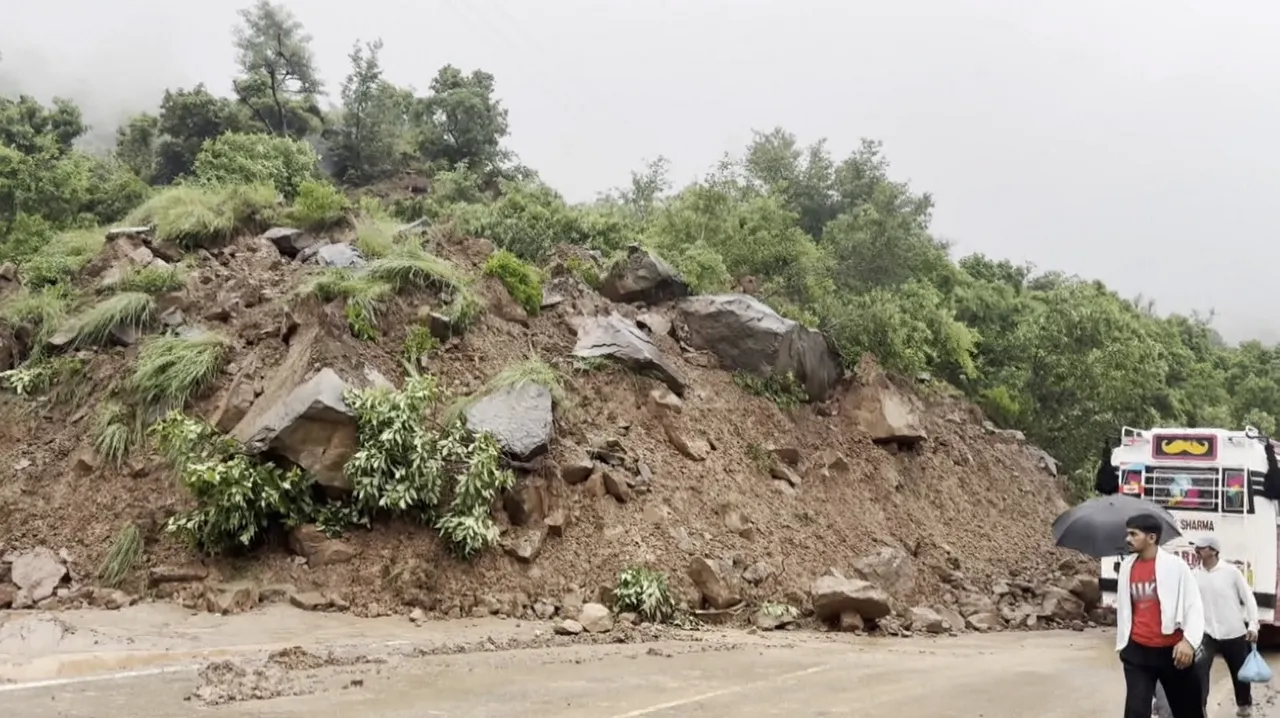 Debris scattered around after a landslide hits Jammu-Srinagar highway, in Udhampur
