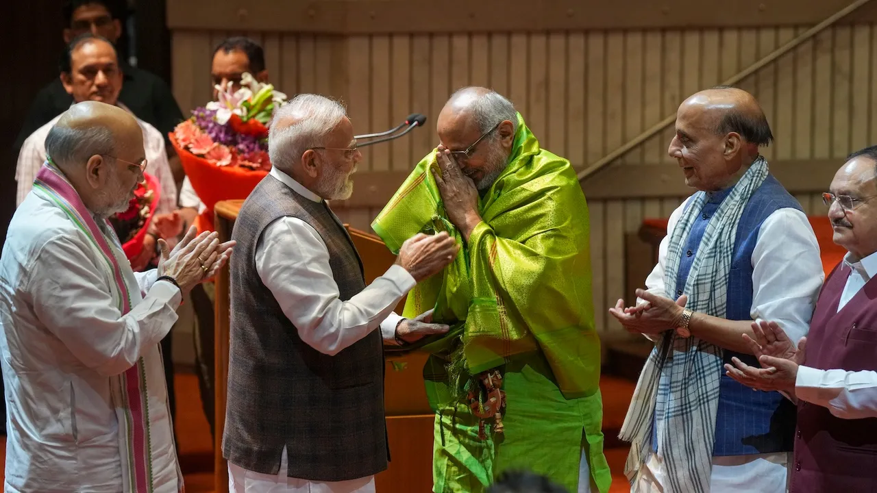 In this Tuesday, Aug. 19, 2025 file photo, Narendra Modi felicitates CP Radhakrishnan as Rajnath Singh, Amit Shah and JP Nadda applaud during the NDA parliamentary party meeting, in New Delhi.