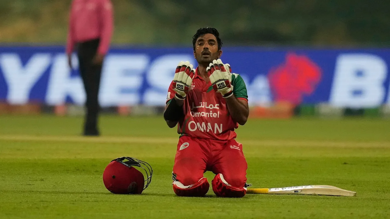 Oman's Aamir Kaleem celebrates after scoring fifty runs during the Asia Cup cricket match between India and Oman at Zayed Cricket Stadium in Abu Dhabi, United Arab Emirates, Friday, Sept. 19, 2025. (AP/PTI Photo)