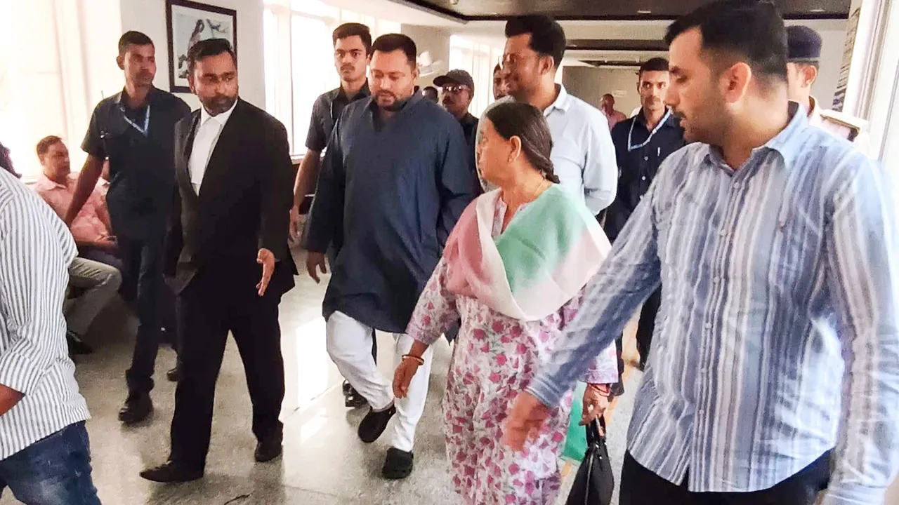 Rabri Devi and son Tejashwi Yadav at Rouse Avenue Court for hearing on charges in the IRCTC scam case, in New Delhi, Monday, Oct. 13, 2025.
