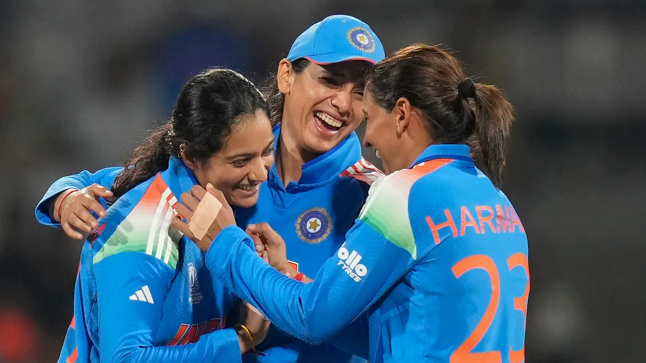 Pratika Rawal, left, celebrates with captain Harmanpreet Kaur, right, and vice captain Smriti Mandhana after taking the catch of New Zealand’s Suzie Bates during an ICC Women’s World Cup ODI in Navi Mumbai on Thursday, October 23, 2025.