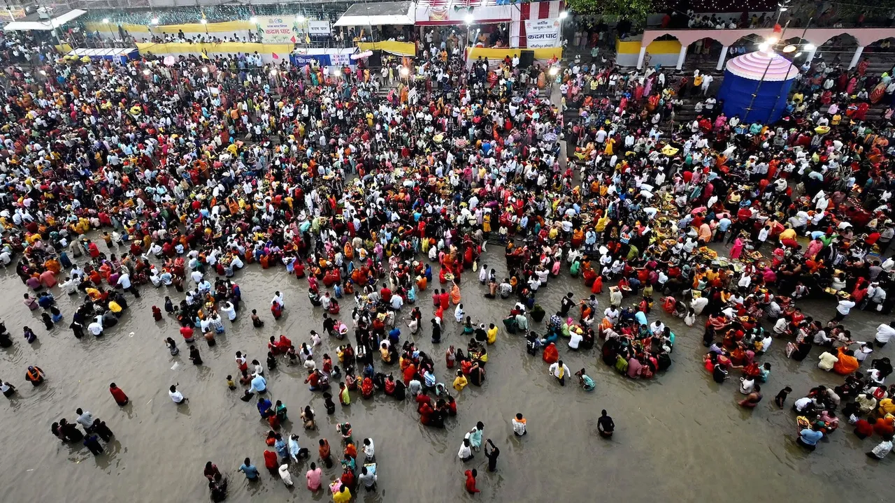 People perform rituals in the Ganga river on the last day of the 'Chhath Puja' festival celebrations, at Gandhi ghat, in Patna, Tuesday, Oct. 28, 2025.