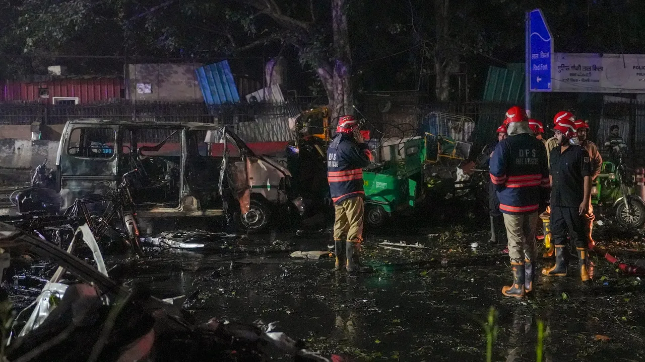 Firefighters at the spot after a blast occurred in a parked car near Red Fort, leaving multiple vehicles in flames, in New Delhi, Monday, Nov. 10, 2025. At least one person was killed in the incident.