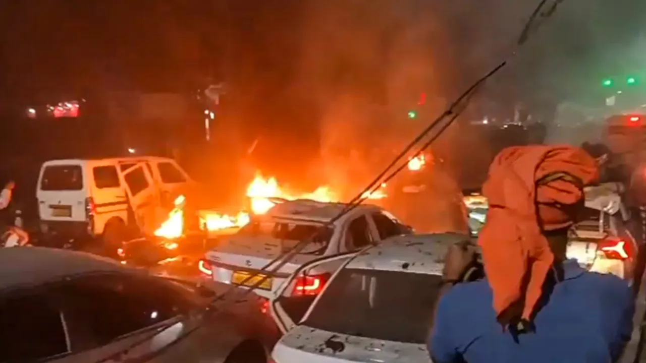 In this screengrab from a video on Nov. 10, 2025, flames rise after a blast occurred in a parked car near Red Fort, leaving multiple vehicles in flames, in New Delhi, Monday, Nov. 10, 2025.