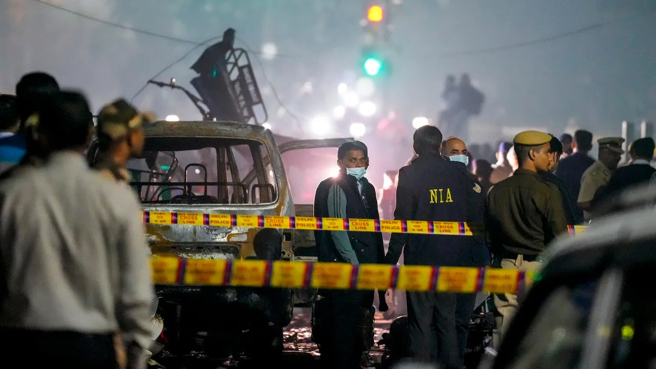 Security personnel at the spot after a blast occurred in a parked car near Red Fort, leaving multiple vehicles in flames, in New Delhi, Monday, Nov. 10, 2025.