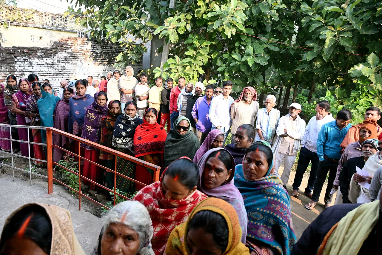 In this image posted on Nov. 11, 2025, People wait queues before casting their votes at a polling station during the second and final phase of the Bihar Assembly elections, in Madhubani.