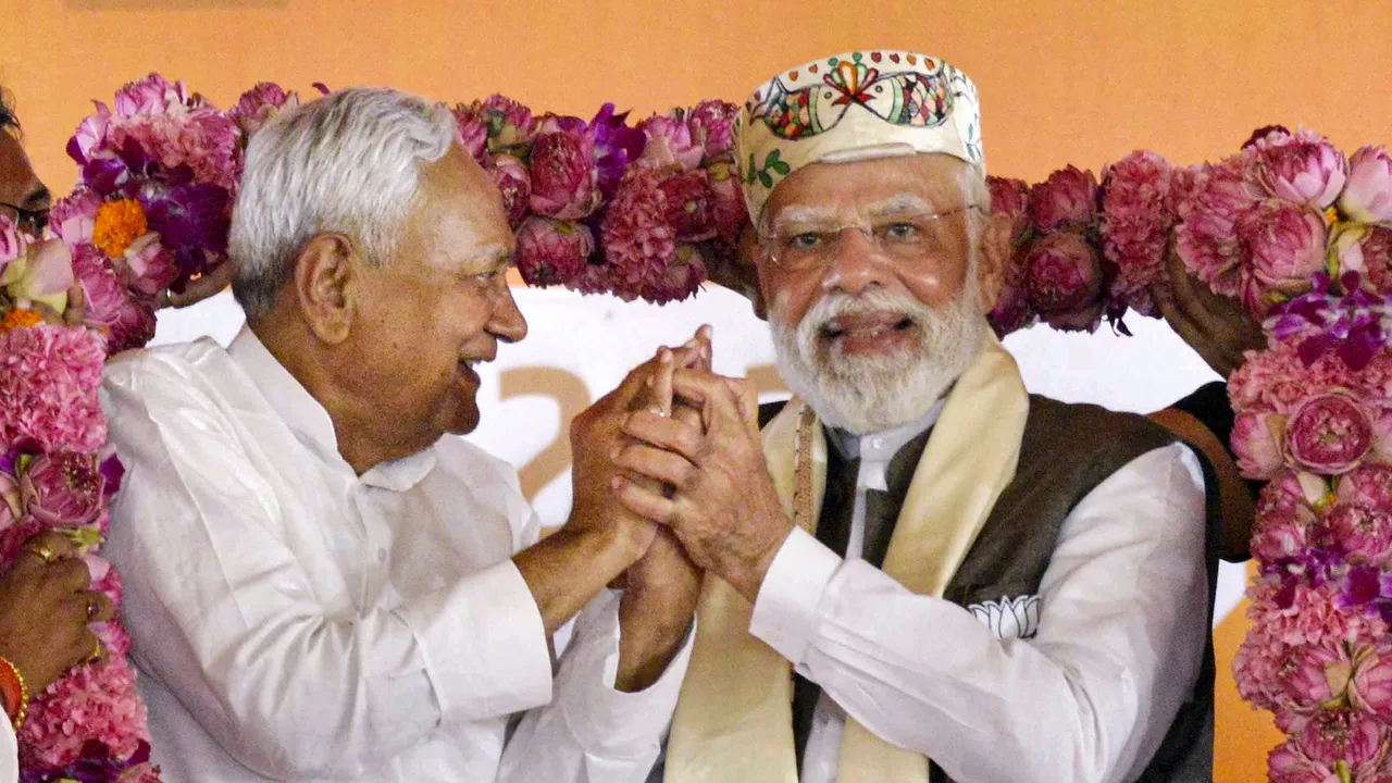 In this Friday, October 24, 2025 file photo, Prime Minister Narendra Modi with Nitish Kumar being garlanded during a rally in Samastipur district.