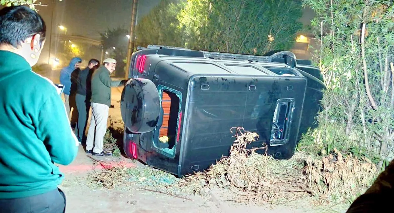 A Mercedes SUV (G63) turned over after it allegedly rammed into three near a mall in Vasant Kunj area, New Delhi, Sunday, Nov. 30, 2025. A 23-year-old man died and two others sustained injuries in the incident.