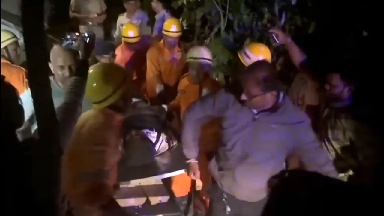 A victim being rescued after a fire broke out following a cylinder blast at a nightclub late Saturday night, in North Goa, Sunday, Dec. 7, 2025.