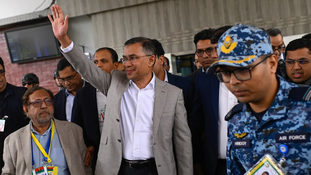 Tarique Rahman waves to supporters at Hazrat Shahjalal International Airport in Dhaka after returning from London, ending more than 17 years of self-imposed exile, Thursday, Dec. 25, 2025.