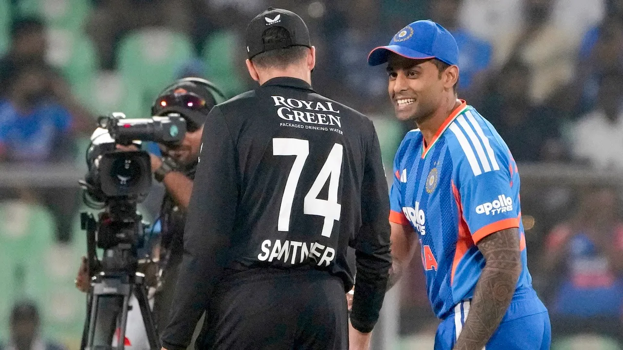 Suryakumar Yadav, right, and New Zealand's Mitchell Santner during toss before the fifth and final T20 International at the Greenfield International Stadium, in Thiruvananthapuram, Kerala, Jan. 31, 2026.
