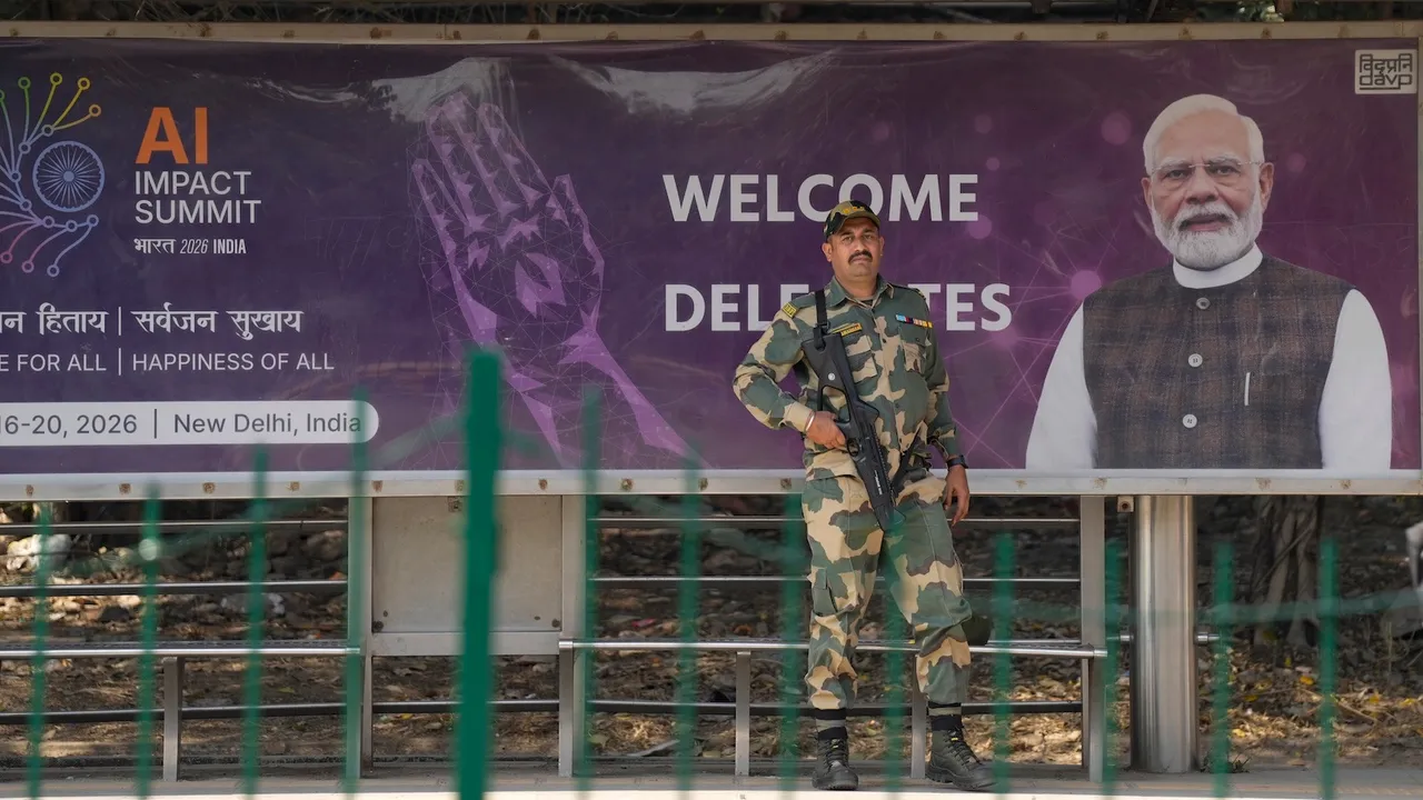 A BSF jawan stands guard at a bus stop, ahead of the AI Impact Summit 2026, in New Delhi, Sunday, Feb. 15, 2026.A BSF jawan stands guard at a bus stop, ahead of the AI Impact Summit 2026, in New Delhi, Sunday, Feb. 15, 2026.