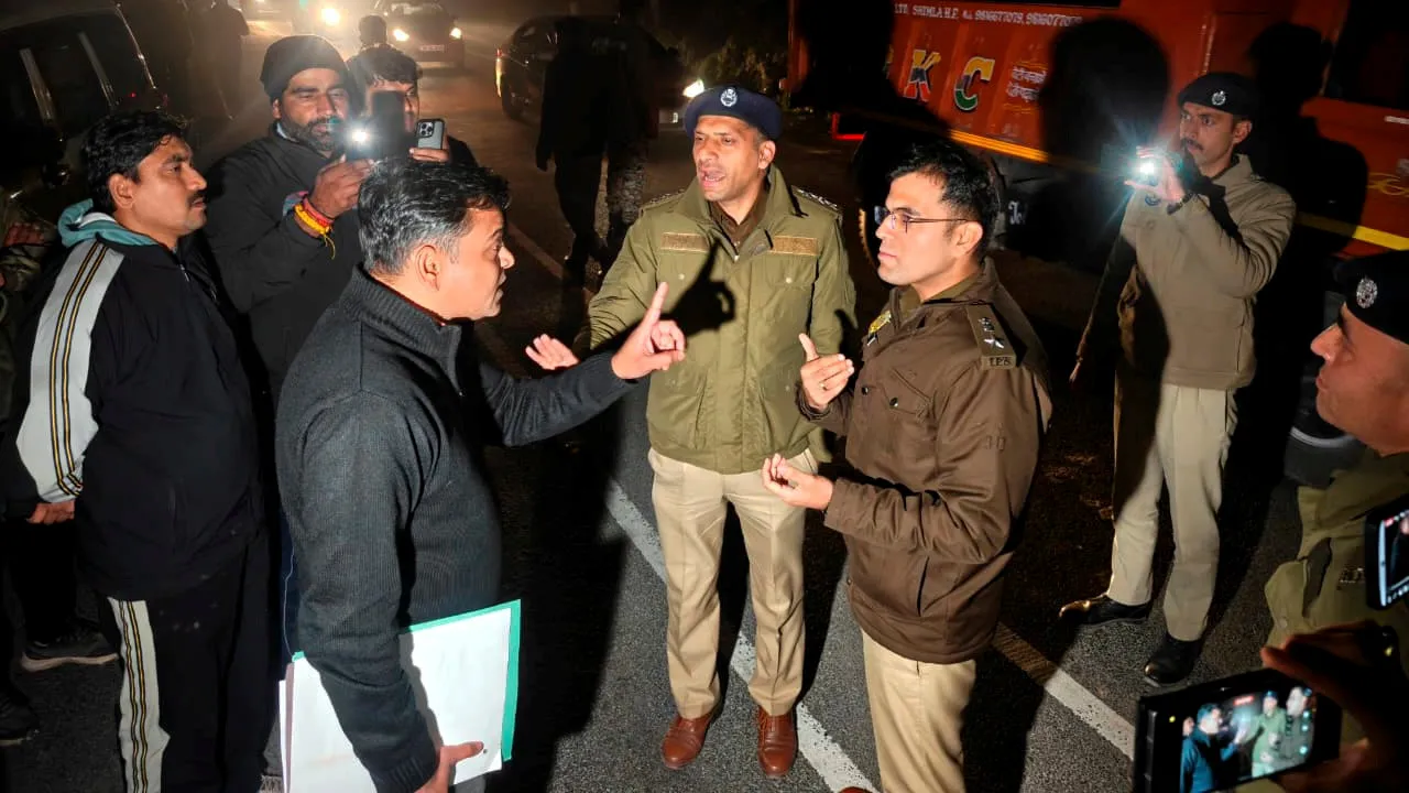 Police officials from Delhi and Shimla in a conversation, in Shimla, Wednesday, Feb. 25, 2026.
