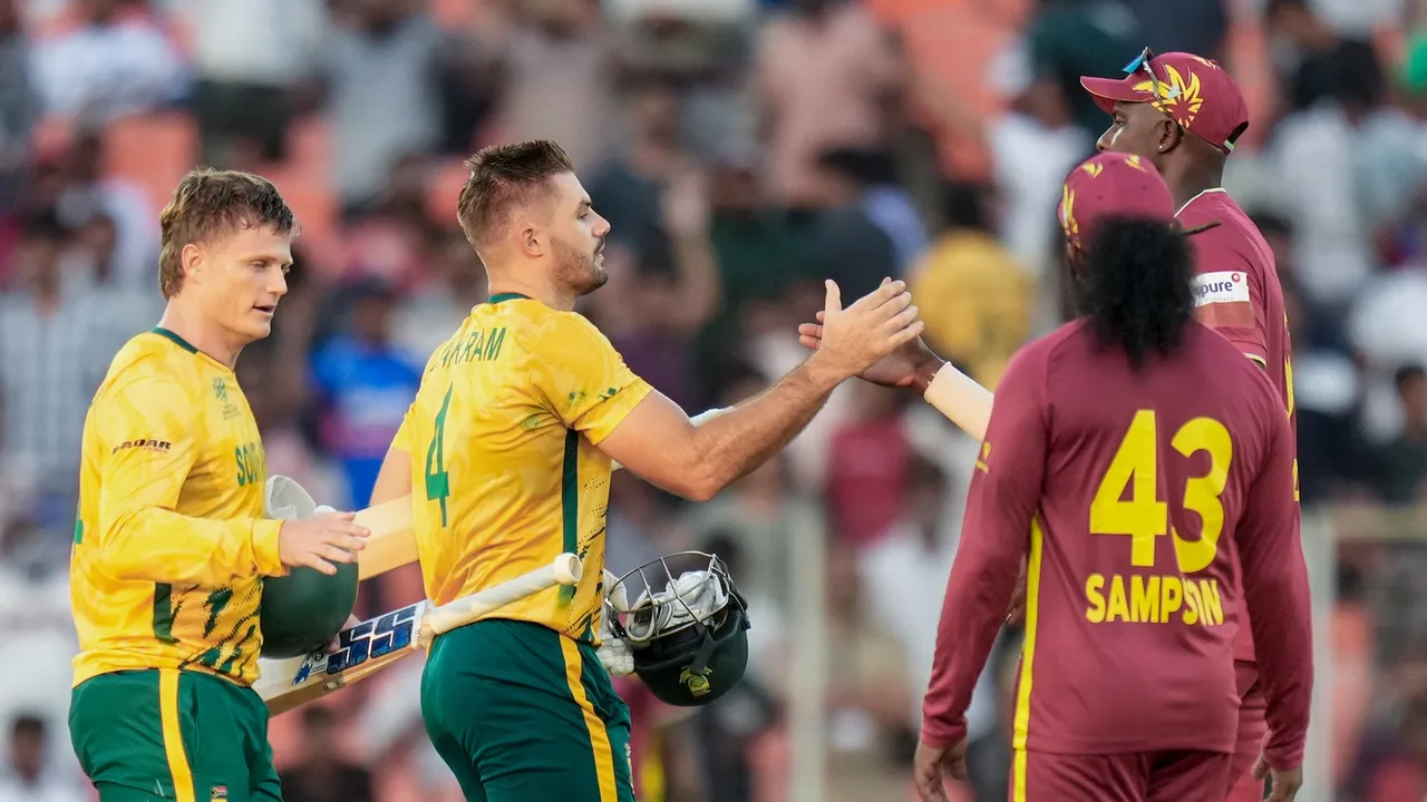 South Africa's captain Aiden Markram and teammate Ryan Rickelton being greeted by West Indies' players after the former's team won the ICC Men's T20 World Cup 2026 cricket match against West Indies, at Narendra Modi Stadium, in Ahmedabad, Thursday, Feb. 26, 2026.