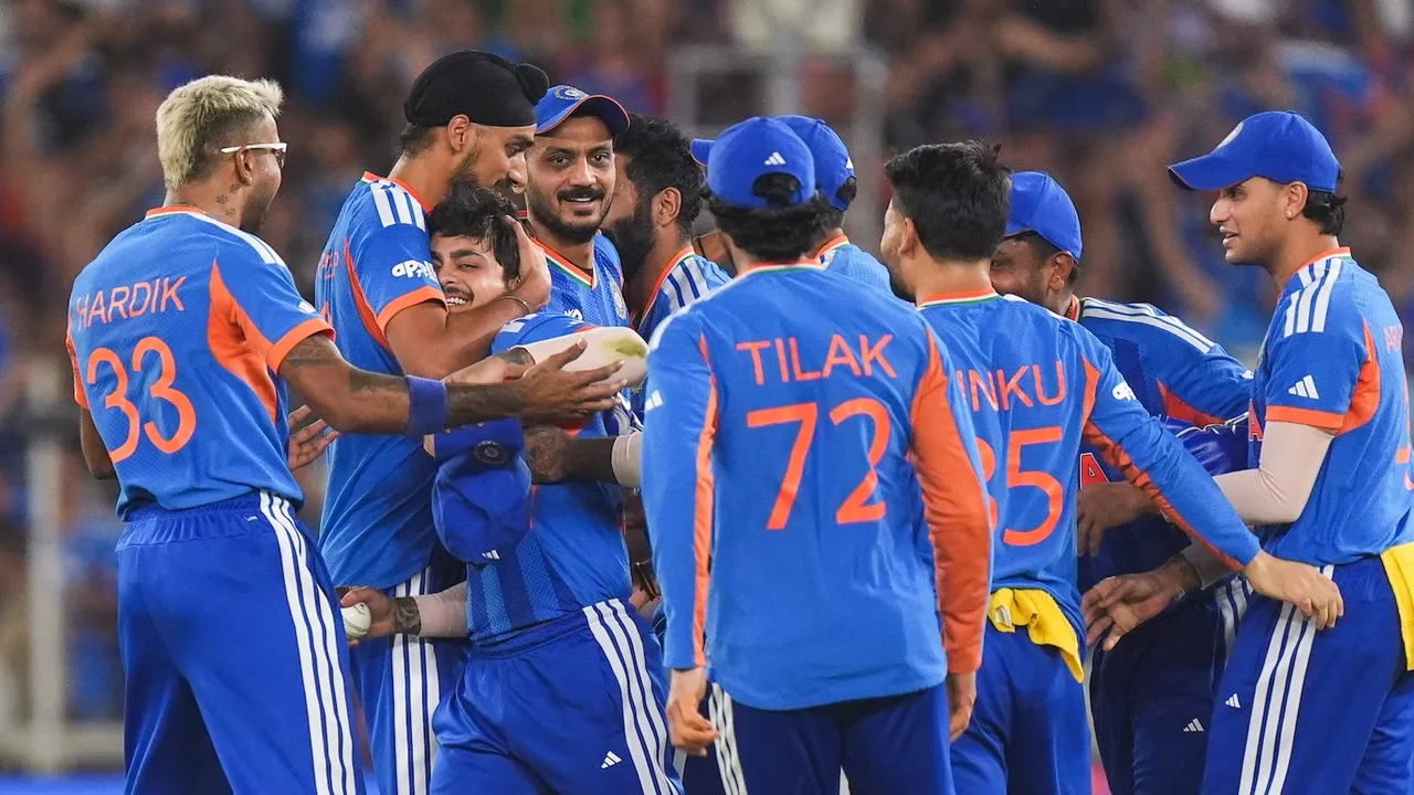 Ishan Kishan celebrates with teammates after taking the catch of New Zealand's Rachin Ravindra during the ICC Men's T20 World Cup 2026 final at Narendra Modi Stadium in Ahmedabad Gujarat on Sunday, March 8, 2026.