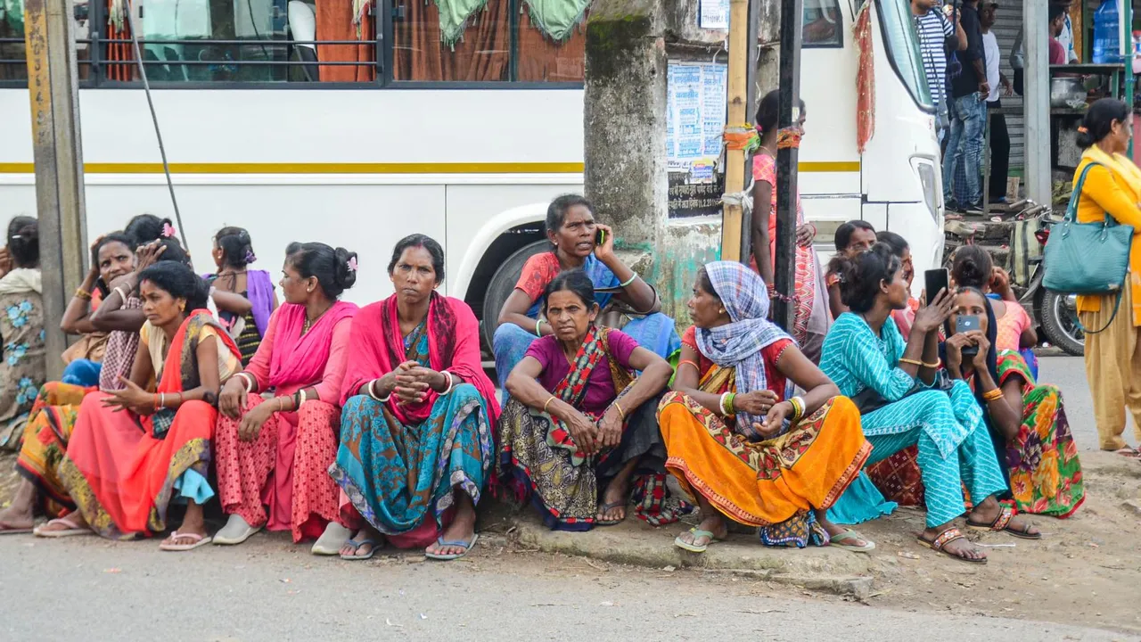 Women passengers wait for transport vehicles amid Bharat Bandh call against the Supreme Court's recent runing on SC/ST reservation, in Ranchi, Wednesday, Aug. 21, 2024.
