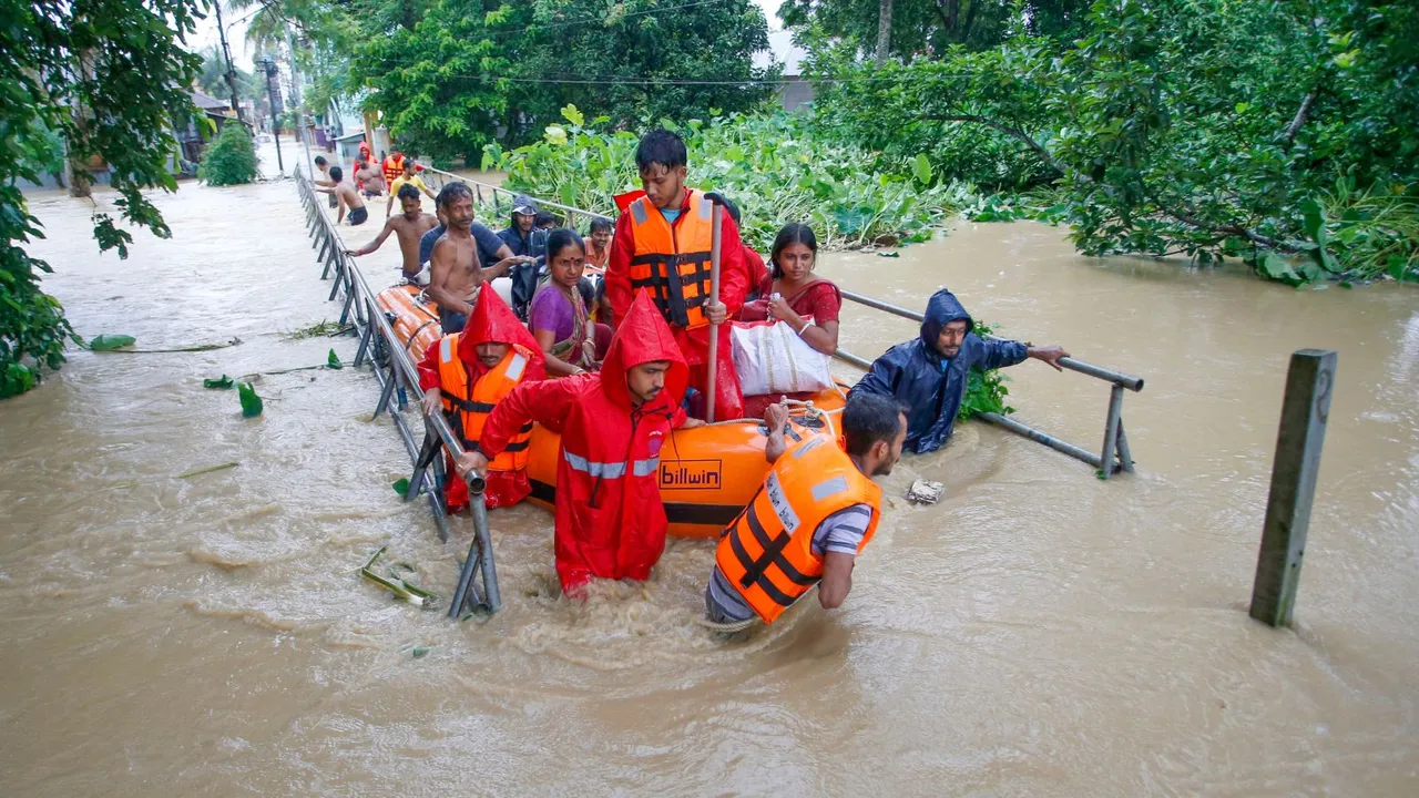 NDRF personnel evacuate people from a flood-affected area following heavy monsoon rainfall, at Adhaynagar village, on the outskirts of Agartala, Thursday, Aug. 22, 2024.