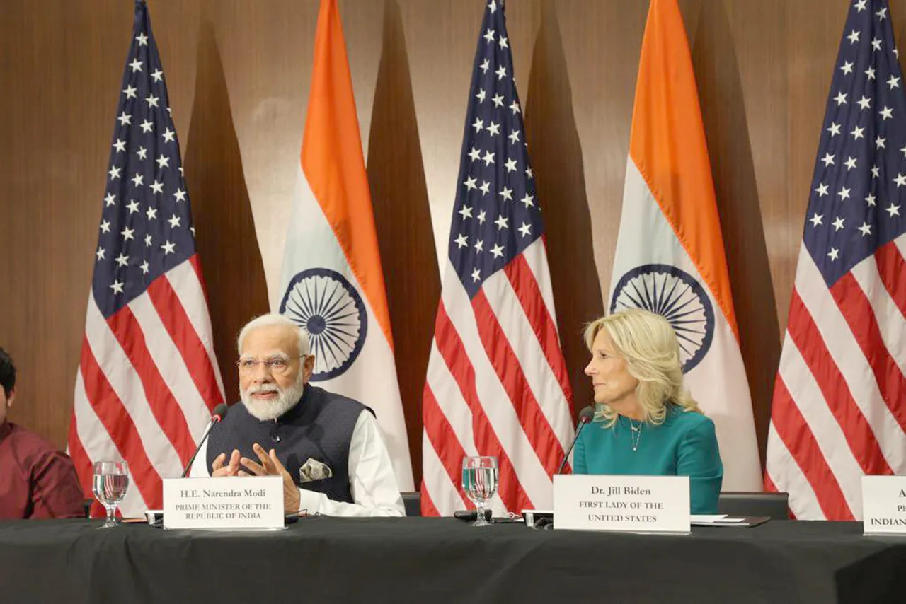 India's Prime Minister Narendra Modi speaks as US first lady Jill Biden looks on at the National Science Foundation in Alexandria