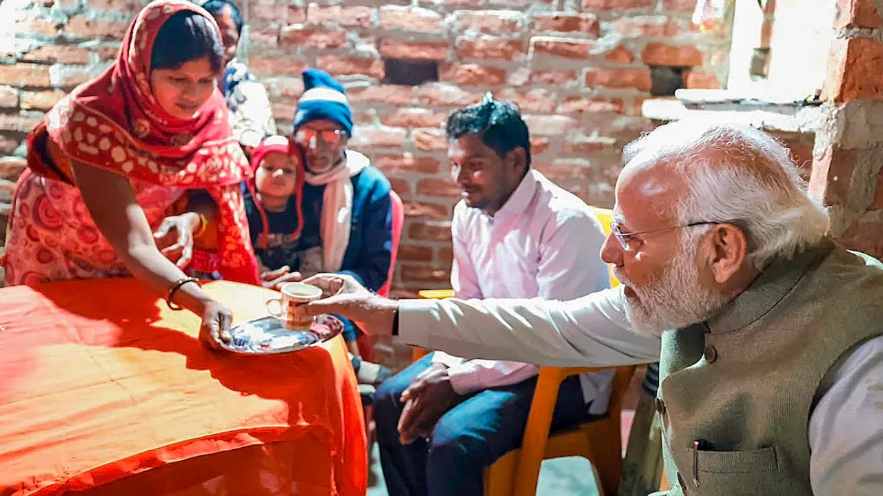 Narendra Modi visits a house of an Ujjwala Yojana beneficiary, in Ayodhya, Saturday, Dec. 30, 2023.