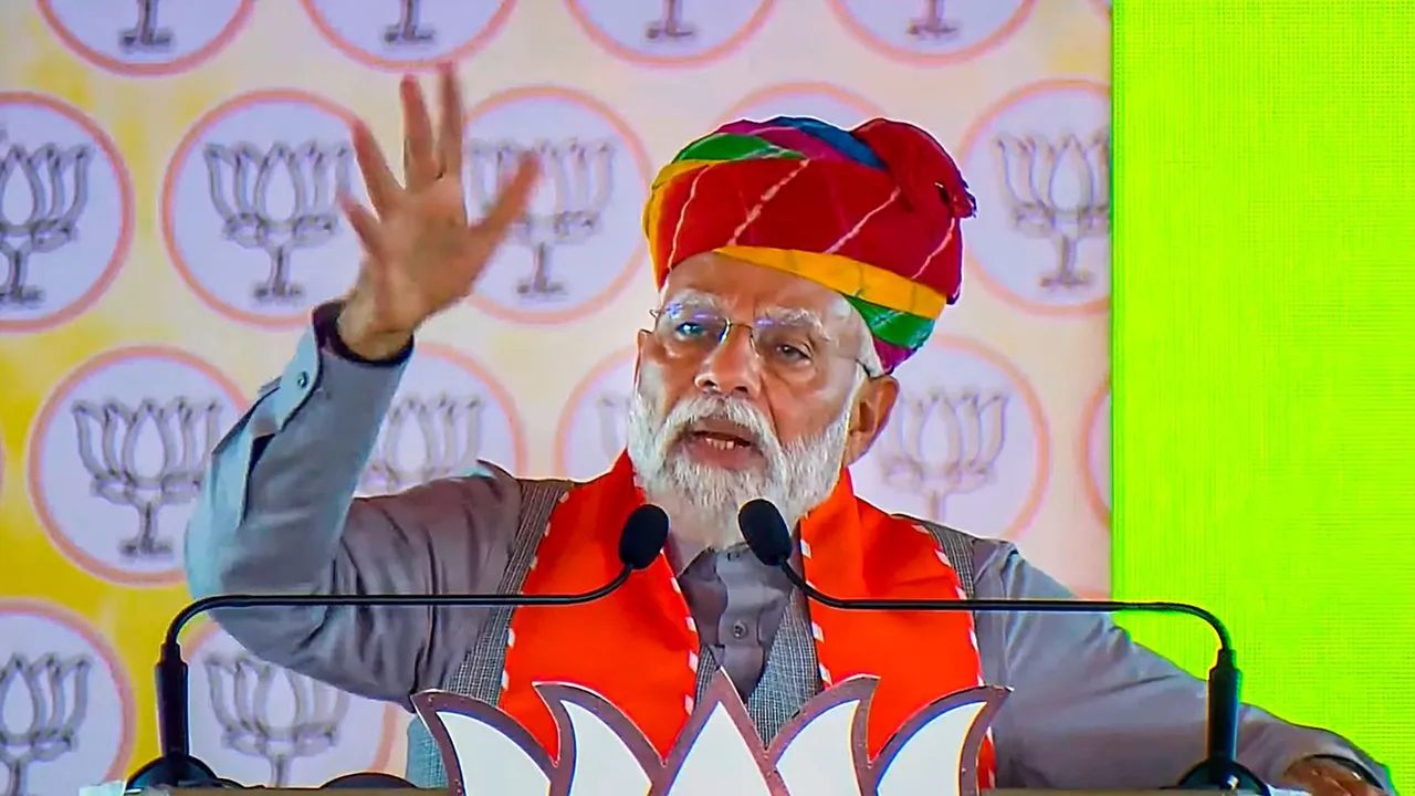 Prime Minister Narendra Modi addresses a public meeting, ahead of the upcoming Lok Sabha elections, in Karauli, Thursday, April 11, 2024