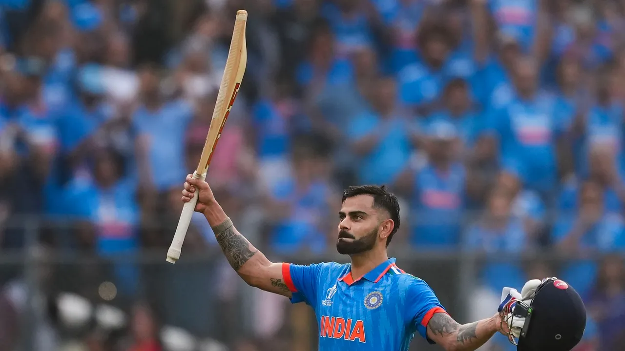  India's Virat Kohli celebrates his 50th century, breaking Sachin Tendulkar's most ODI hundreds record, during the ICC Men's Cricket World Cup 2023 semi-final match