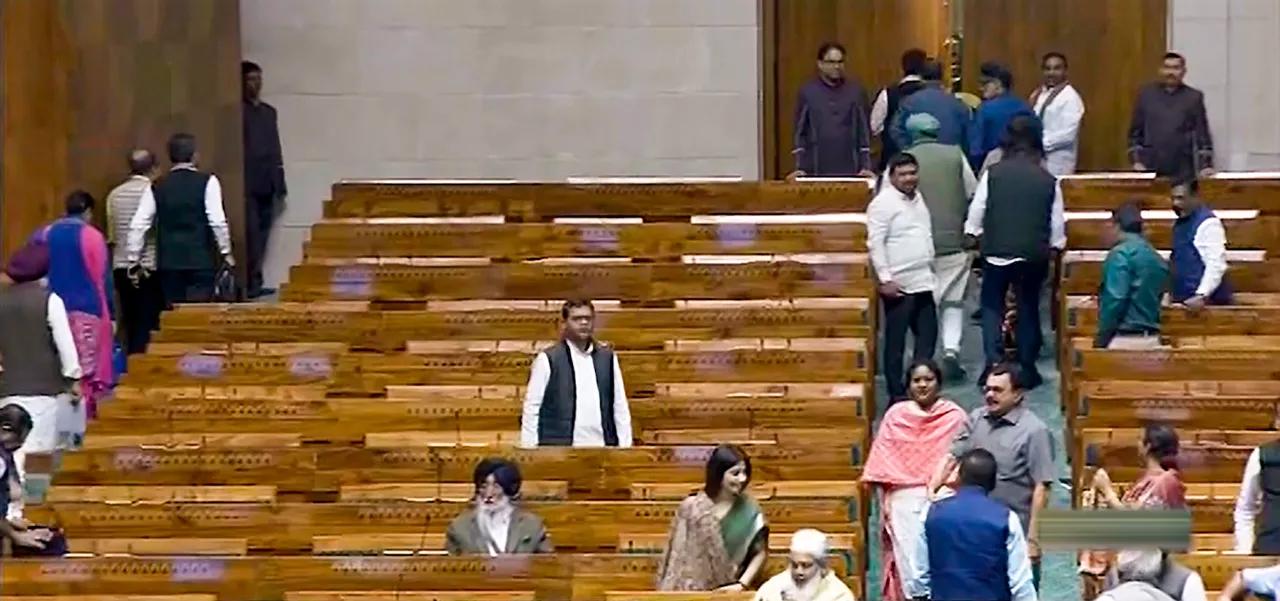 Opposition MPs walk out of the Lok Sabha during the Winter session of Parliament, in New Delhi, Wednesday, Dec. 6, 2023.