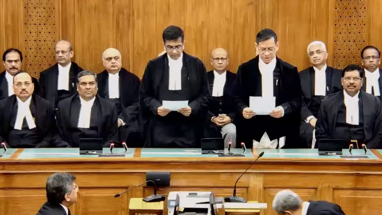 Chief Justice of India (CJI) Justice DY Chandrachud administers oath of office to Justice Nongmeikapam Kotiswar Singh during the latter's swearing-in ceremony as Judge of Supreme Court of India, in New Delhi, Thursday, July 18, 2024.