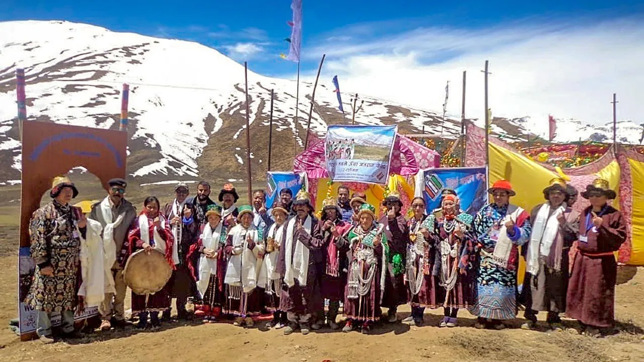 In this undated photo, voters pose for photos after casting their votes at a polling station, in Ladakh