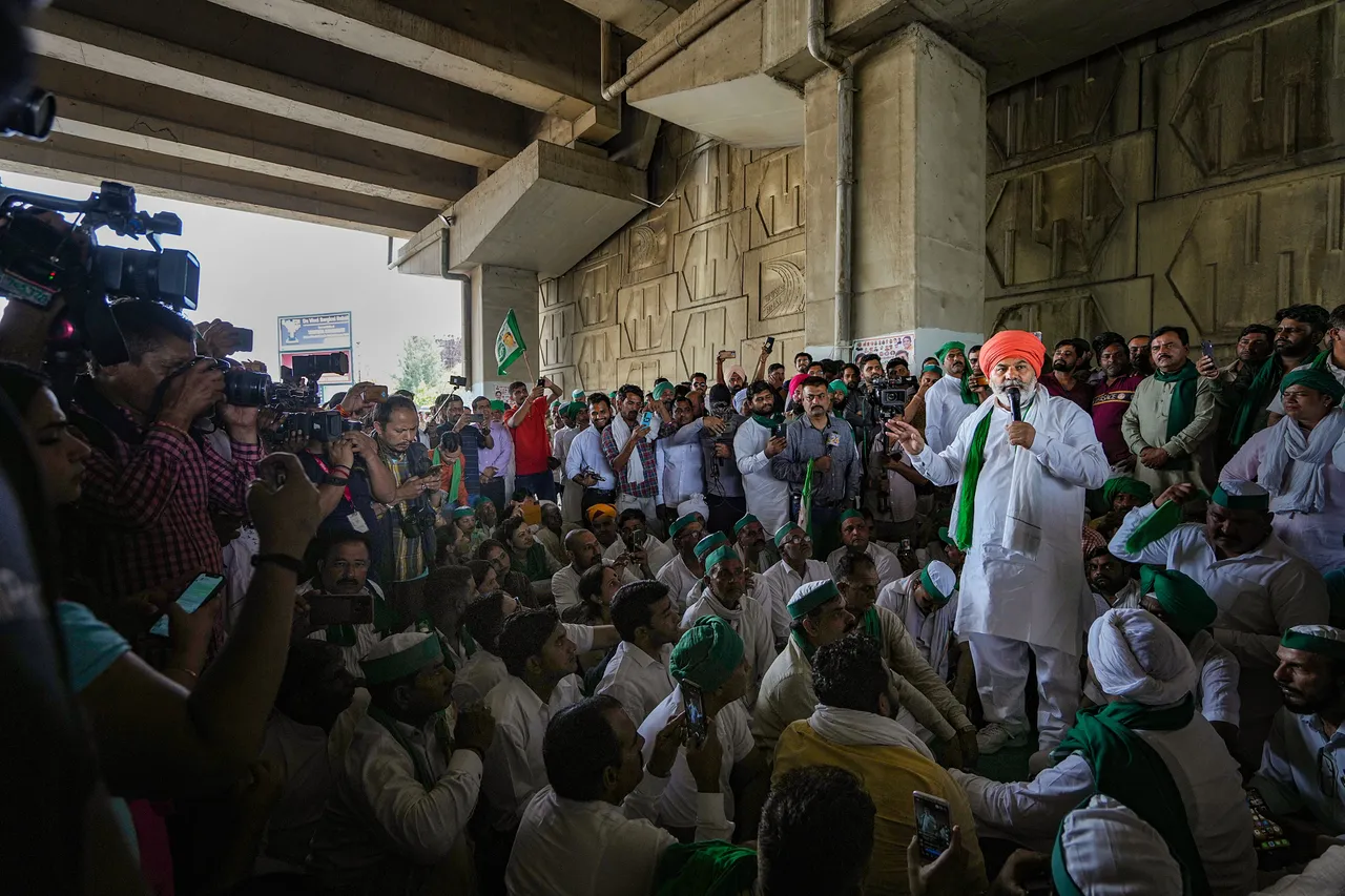 Bharatiya Kisan Union (BKU) leader Rakesh Tikait addresses farmers gathered near the Ghazipur border to join the wrestlers protesting against WFI chief Brij Bhushan Sharan Singh, in New Delhi, Sunday, May 28, 2023