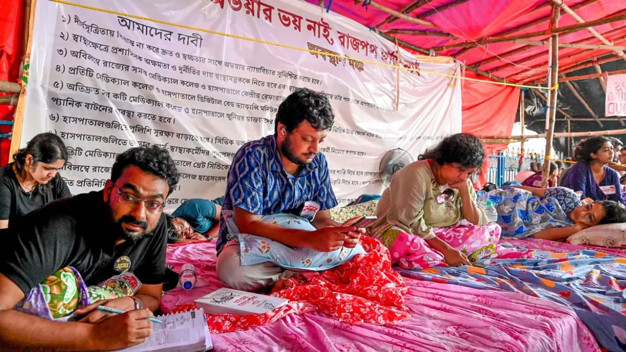 Junior doctors sit on fast to protest over the alleged rape and murder of a trainee doctor at the R G Kar Medical College and Hospital, in Kolkata