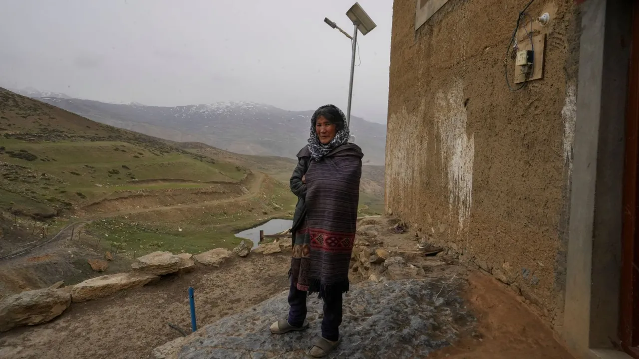 A Local woman of Tashigang stands outside her home, on the eve of the seventh Lok Sabha elections in Kinnaur district, Himachal Pradesh