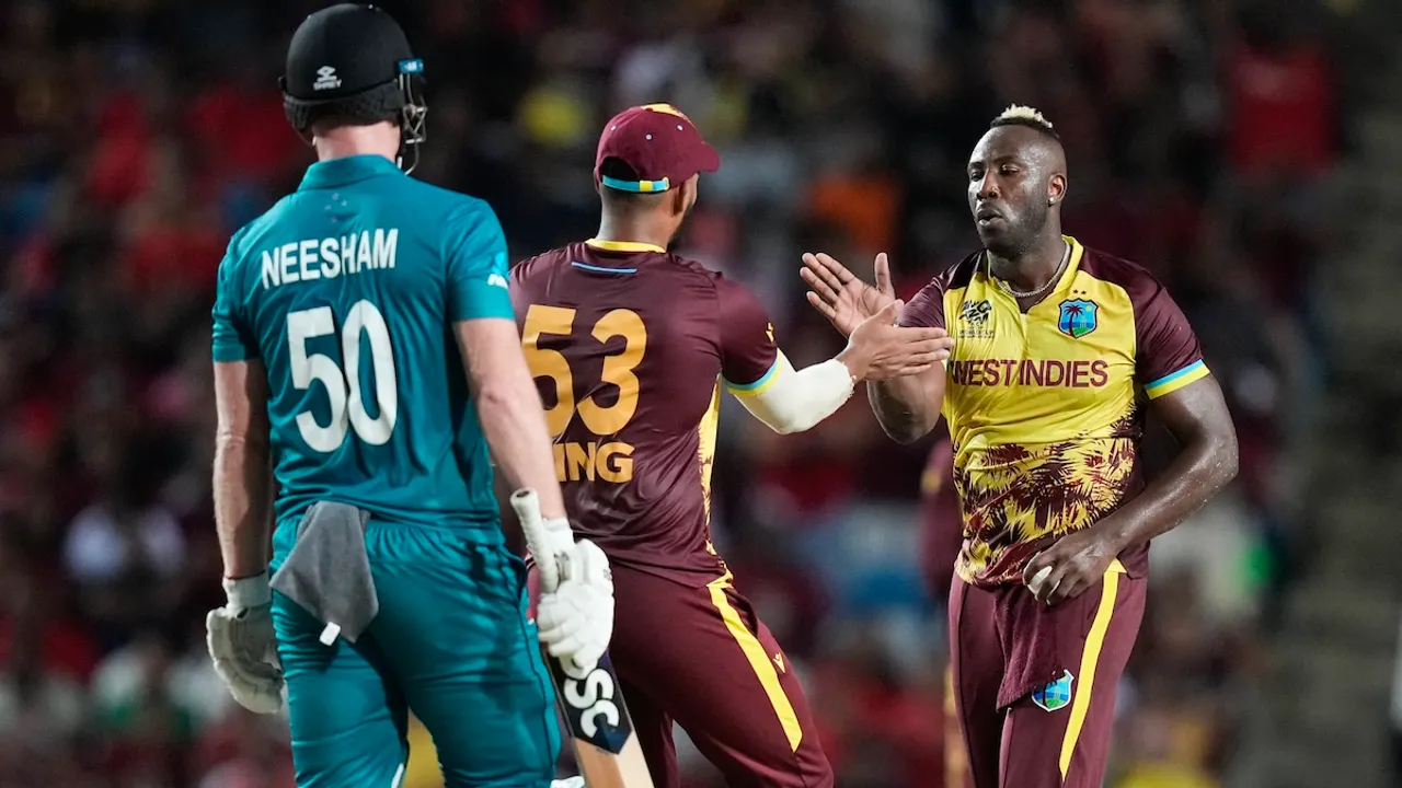West Indies' Andre Russell, right, gestures with teammate Brandon King as New Zealand's Jimmy Neesham, left, watches during the men's T20 World Cup cricket match between the West Indies and New Zealand at the Brian Lara Cricket Academy, Tarouba, Trinidad and Tobago, Wednesday, June 12, 2024.