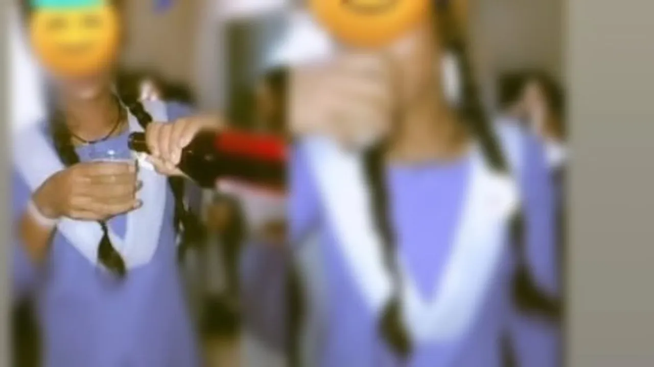 Screengrab of a video of female students drinking beer inside a government school in Chhattisgarh's Bilaspur district on Tuesday