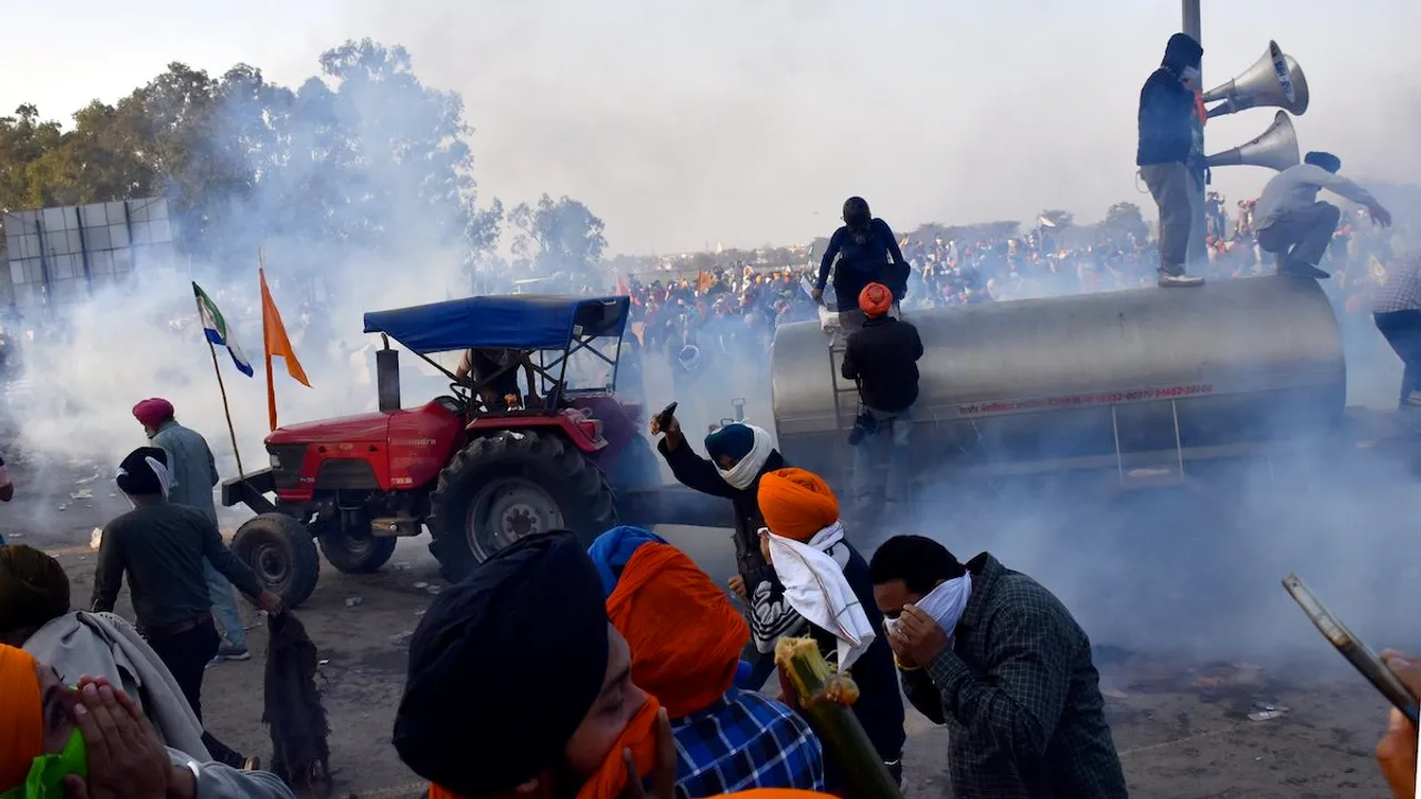 Police use tear gas to disperse farmers gathered at the Punjab-Haryana Shambhu border during their 'Delhi Chalo' march, in Patiala district, Wednesday, Feb. 14, 2024. 