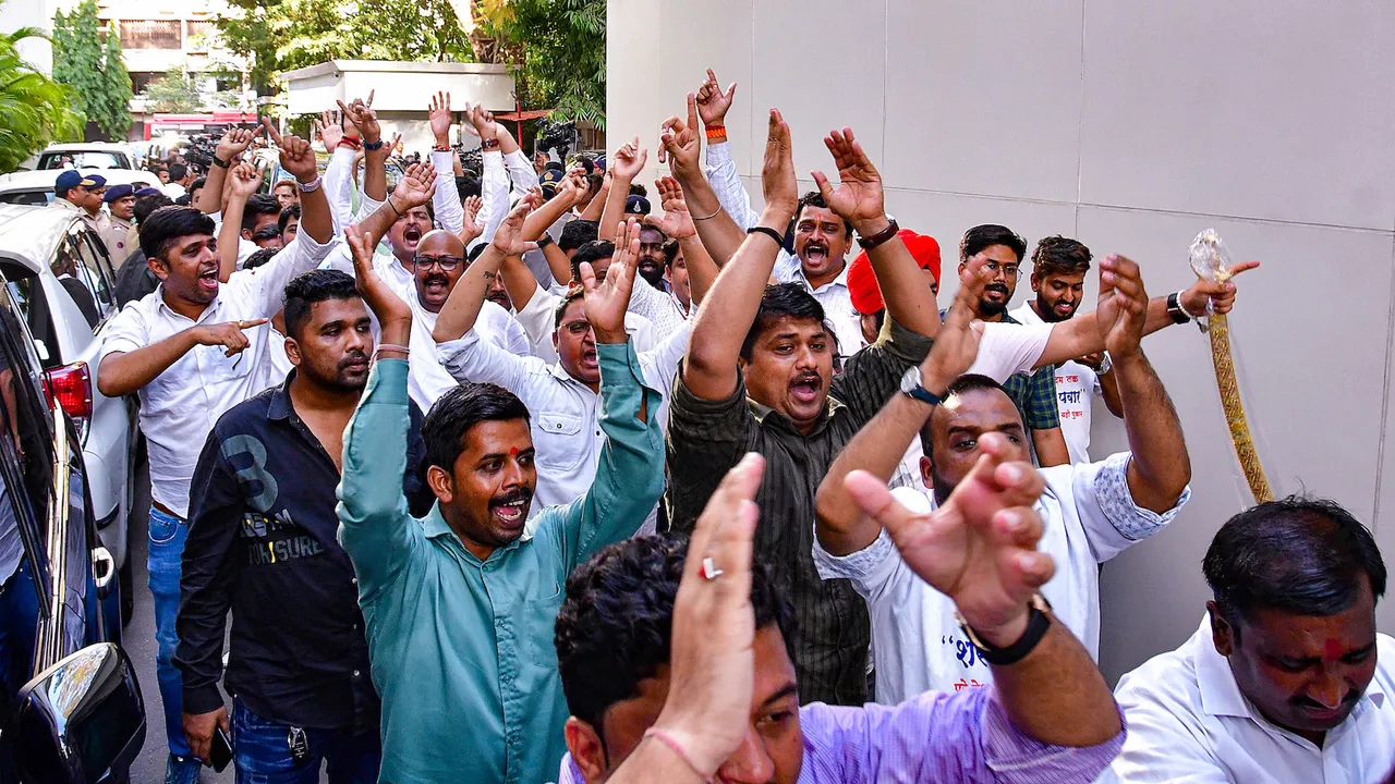 Nationalist Congress Party supporters celebrates after the party chief Sharad Pawar withdrew his resignation as the Nationalist Congress Party President on May 5