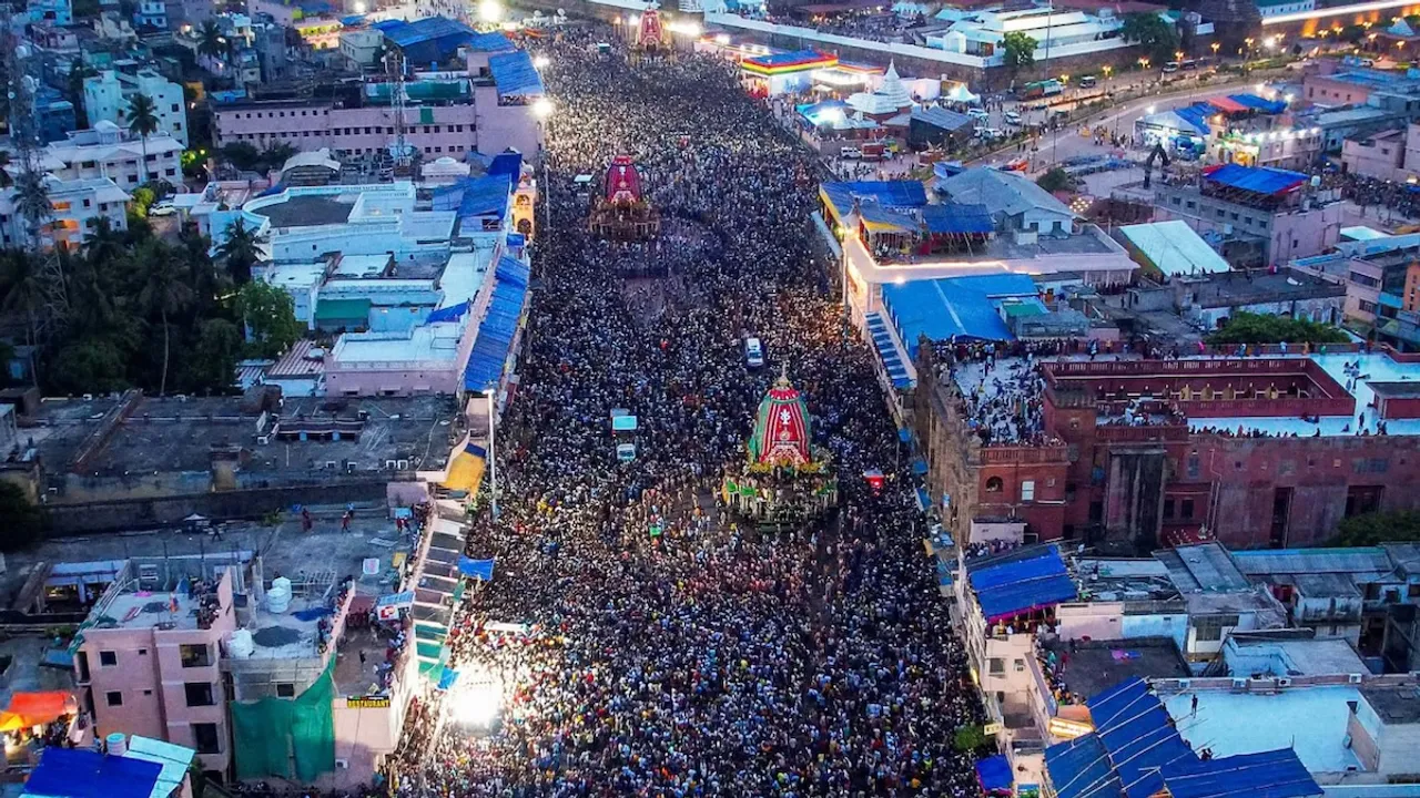 Devotees take part in the annual Rath Yatra, in Puri.