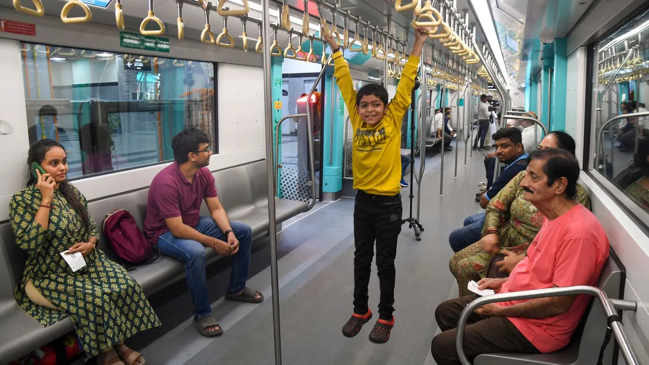 People ride a metro on the Bandra Kurla Complex (BKC) to Aarey underground section of Mumbai Metro Line 3 after it was opened for public, in Mumbai, Monday, Oct. 7, 2024.