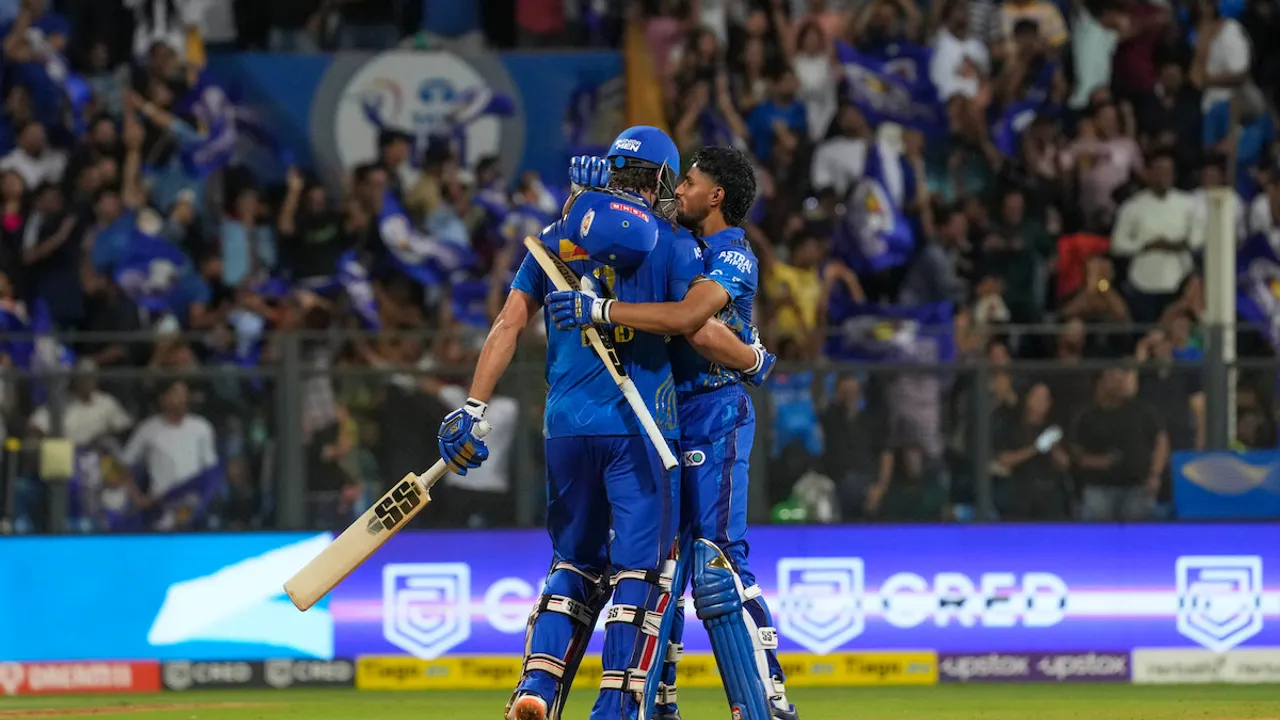 Mumbai Indians batters Tim David and Tilak Varma celebrate after beating Rajasthan Royals by 6 wickets on April 30