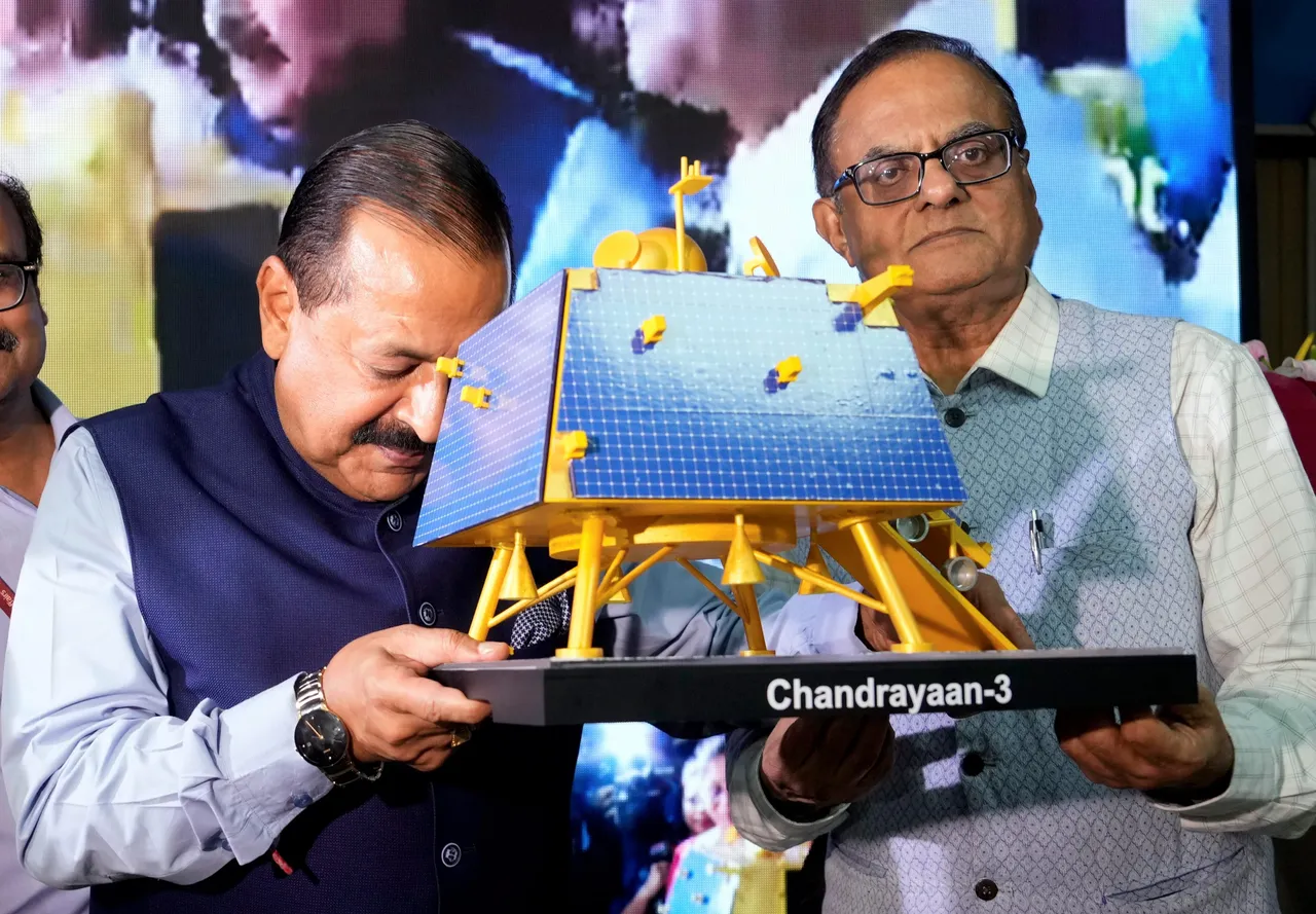 Union Minister of State for Science and Technology Jitendra Singh touches a replica of Chandrayaan-3's lander after its successful soft landing on the surface of the Moon