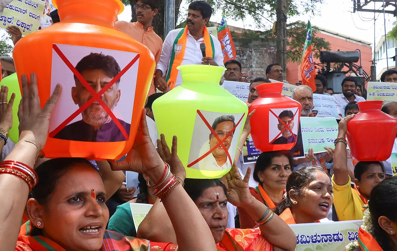 BJP workers stage a protest against the release of Cauvery river water to Tamil Nadu from dams in Karnataka, in Bengaluru