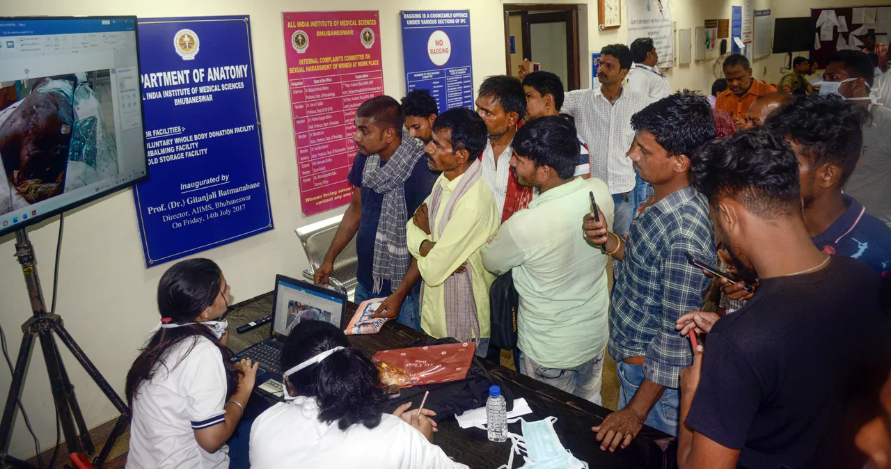 Family members during identification of deceased passengers from the recent triple-train accident, at the AIIMS helpdesk, in Bhubaneswar