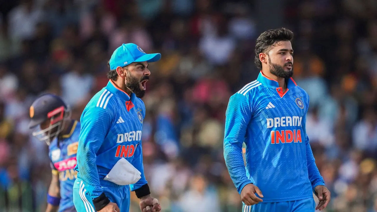 India's Riyan Parag and Virat Kohli celebrate the wicket of Sri Lanka's Charith Asalanka during the third one-day international (ODI) cricket match between India and Sri Lanka