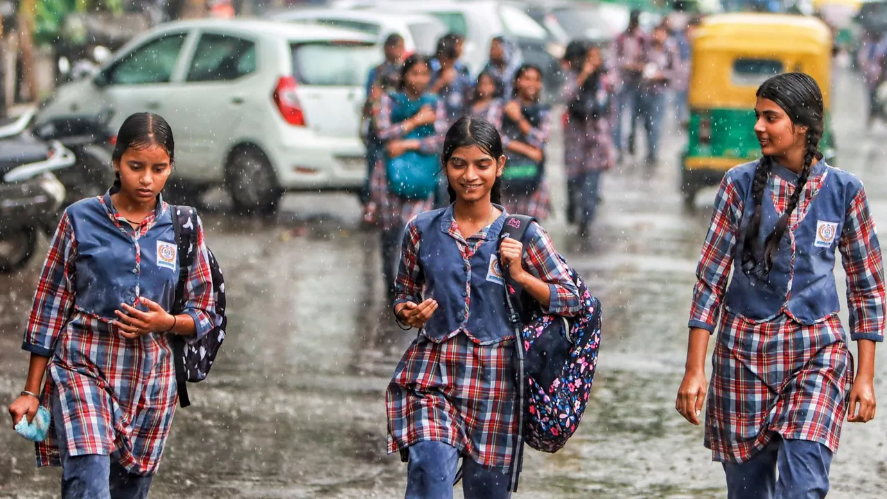 School students during rains, in New Delhi