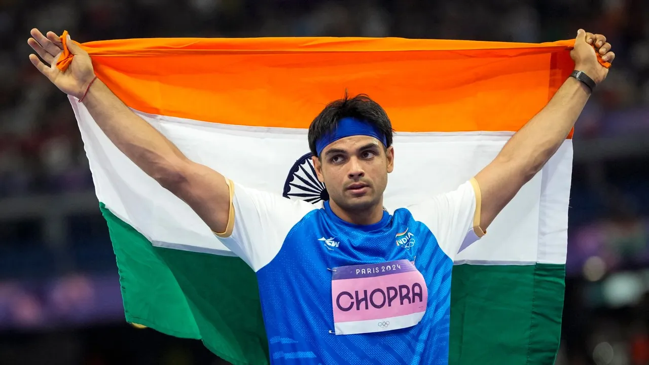 India's Neeraj Chopra celebrates after winning the silver medal in the men's javelin throw athletics event at the 2024 Summer Olympics, in Paris, France, Thursday, Aug. 8, 2024.