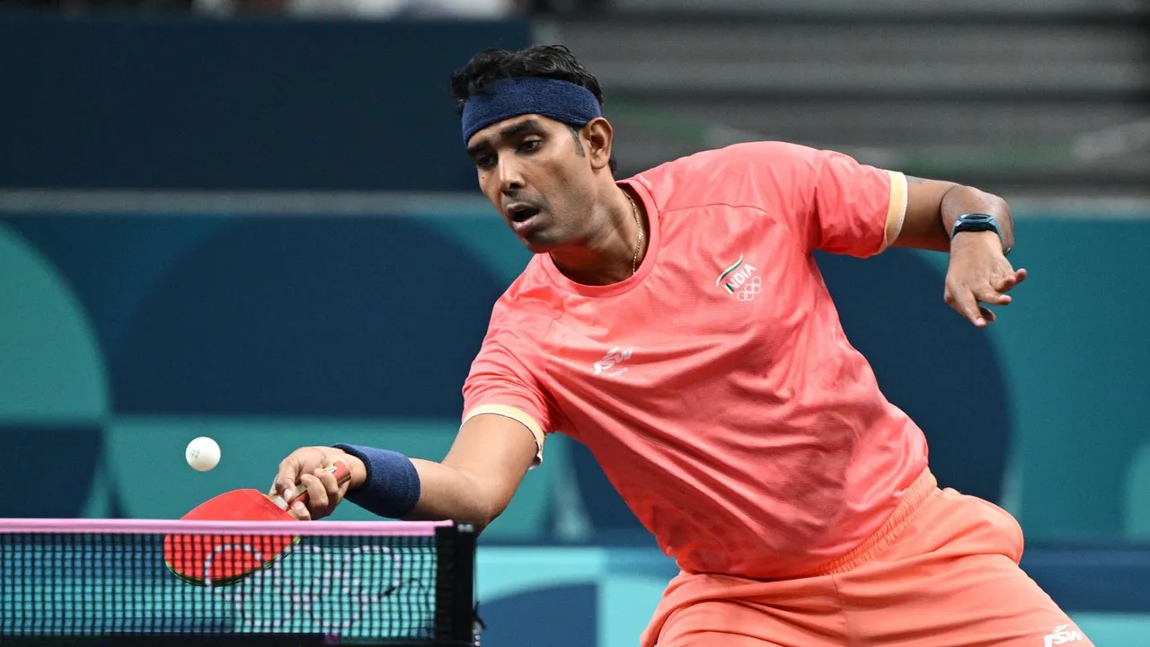 Sharath Kamal Achanta of India in action against Deni Kozul of Slovenia during the Men Singles Round of 64 of the Table Tennis competitions in the Paris 2024 Olympic Games, at The South Paris Arena in Paris, France, 28 July 2024.