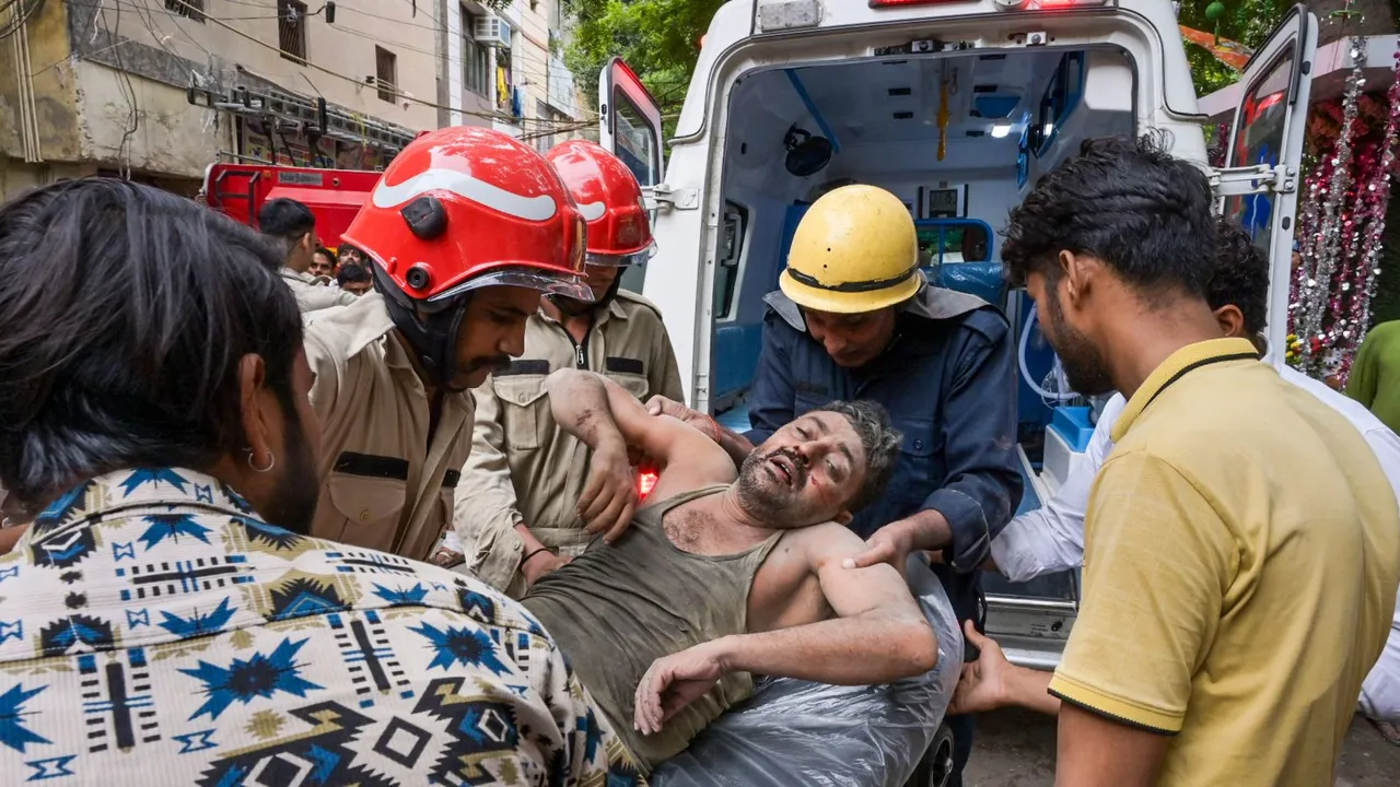 An injured being rescued after a two-storey house collapsed in Bapa Nagar area of Karol Bagh, in New Delhi, Wednesday, Sept. 18, 2024.