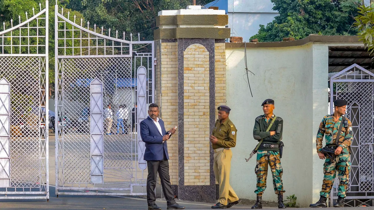Security personnel stand guard outside the official residence of Jharkhand Chief Minister Hemant Soren, in Ranchi