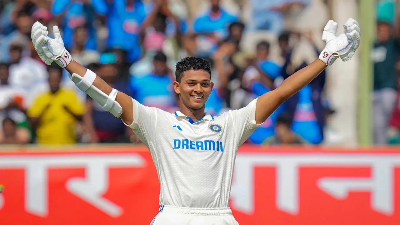 India's batter Yashasvi Jaiswal celebrates his century during the first day of the second Test cricket match between India and England