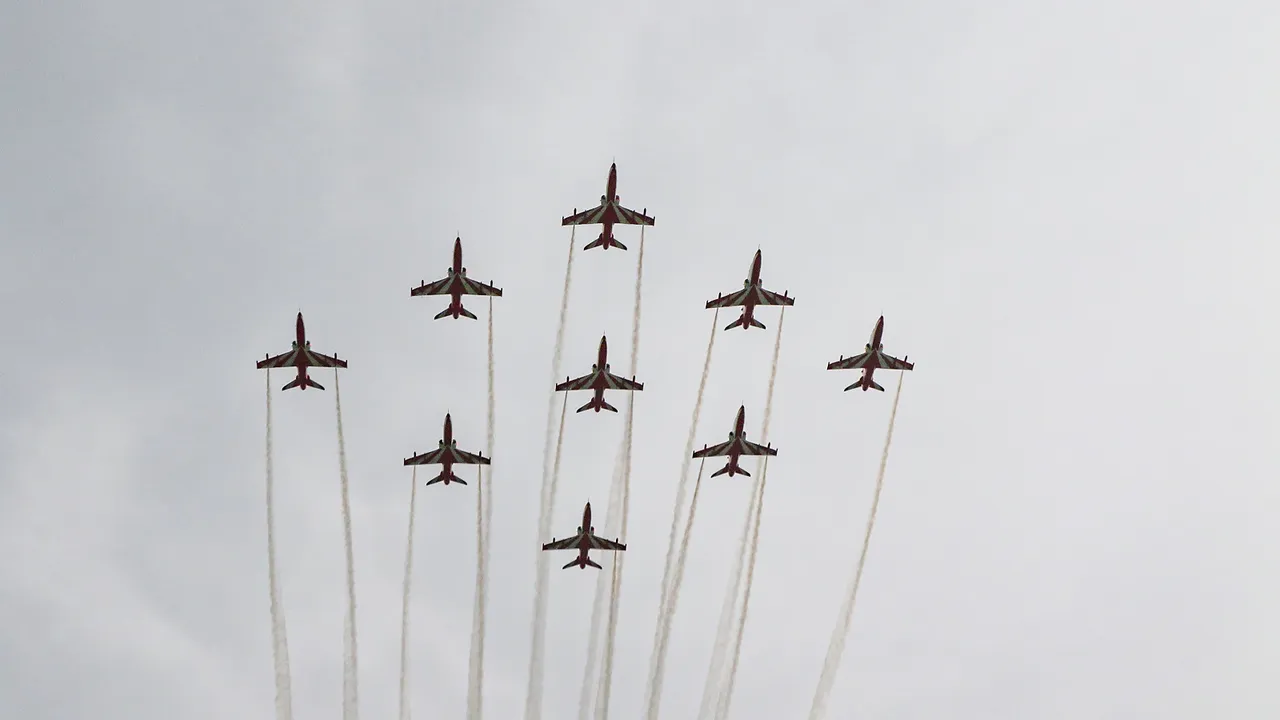 Indian Air Force’s (IAF) 'Surya Kiran' aerobatic team performs during diamond jubilee celebrations of Air Force Station Jammu, in Jammu